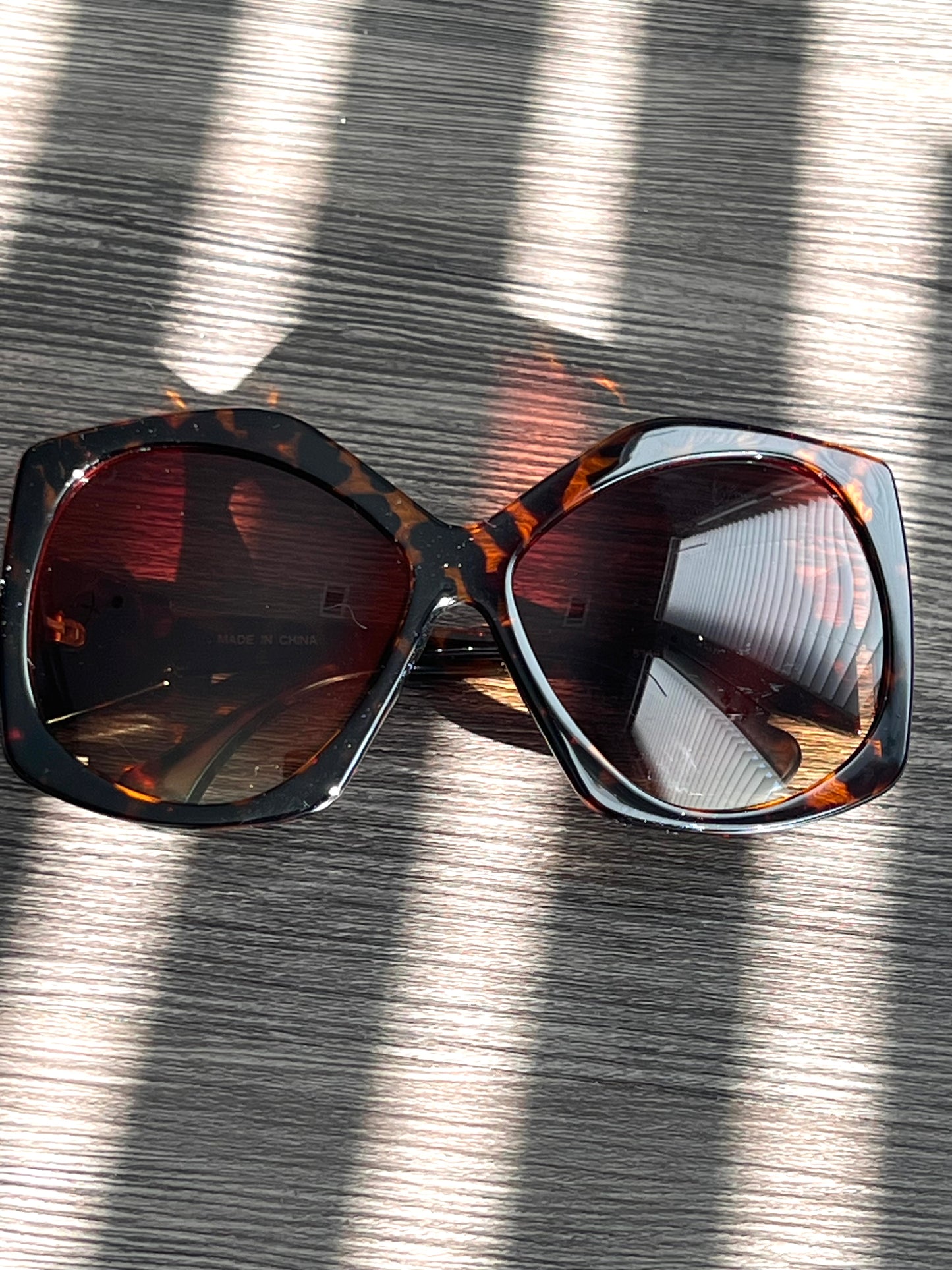 Tortoise oversized sunglasses with gradient brown lenses, neutral-toned and flattering for all skin tones