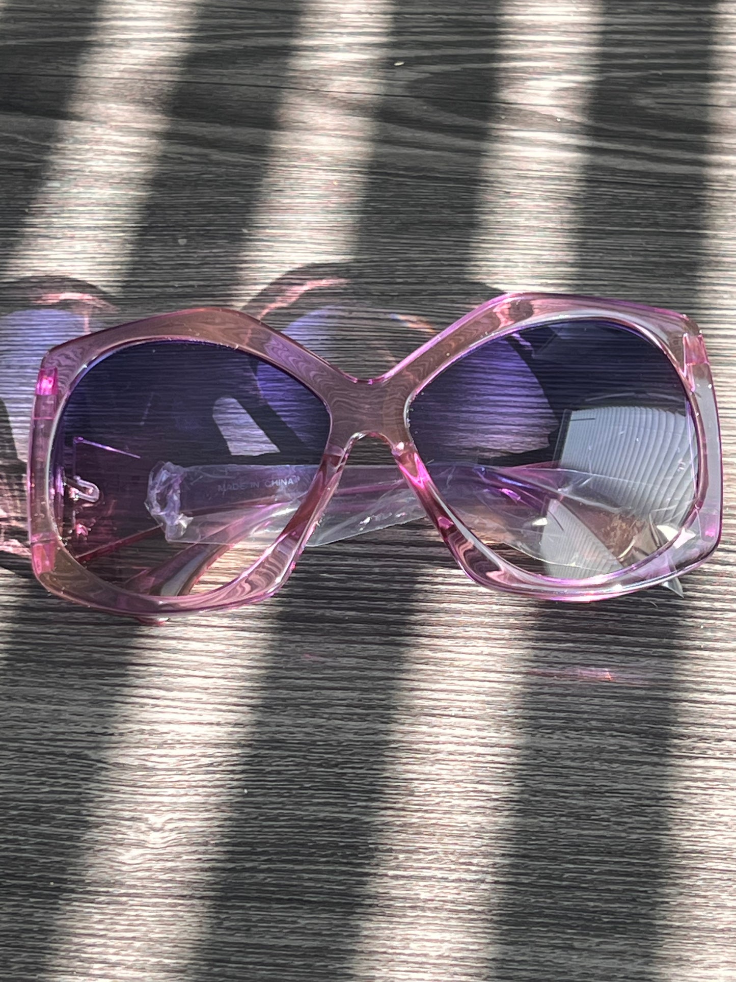Light pink gradient oversized sunglasses with translucent frame and soft fade lenses, stylish and feminine design