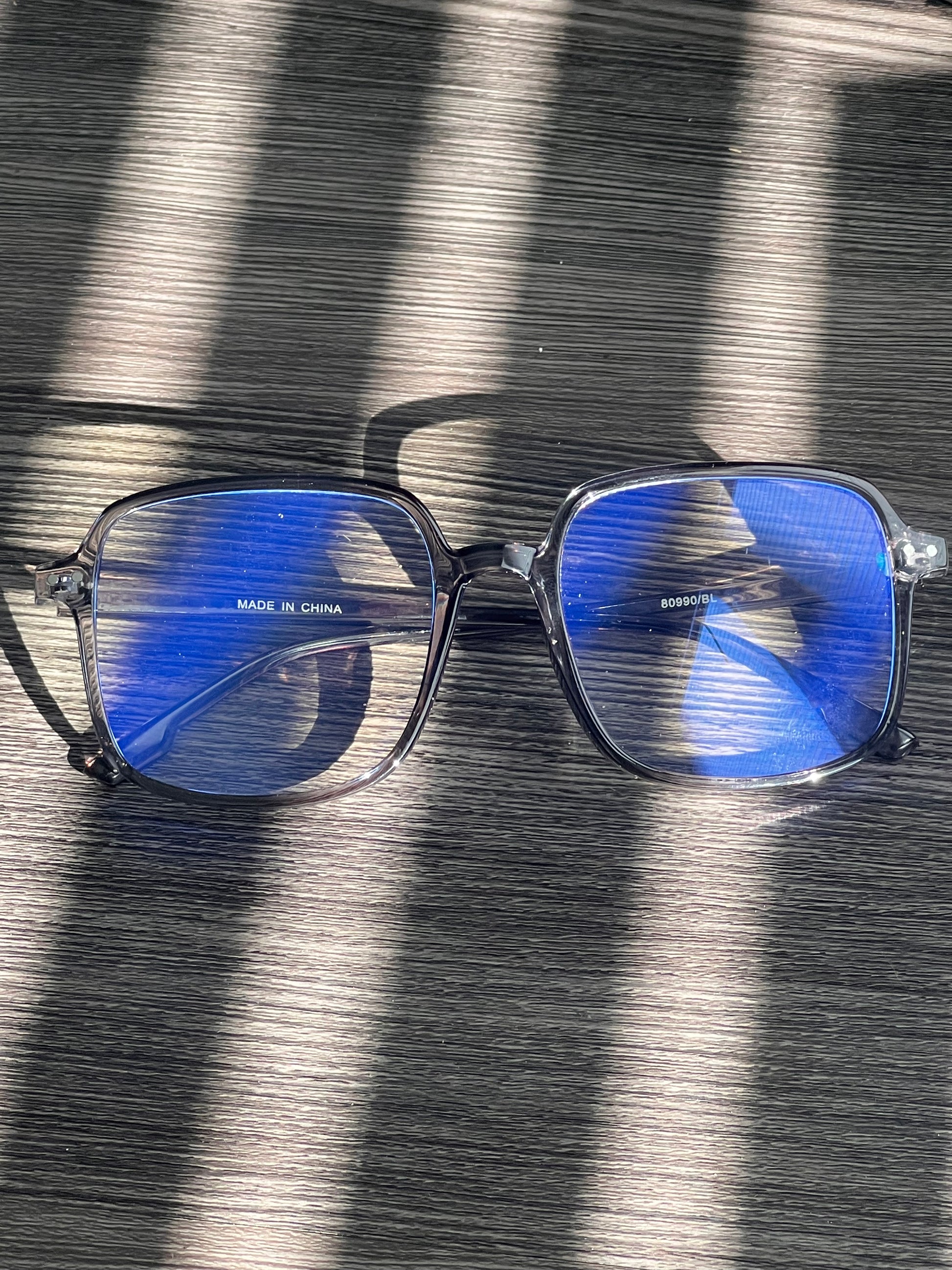 Smoky gray clear-frame blue light blocking glasses designed for screen time comfort