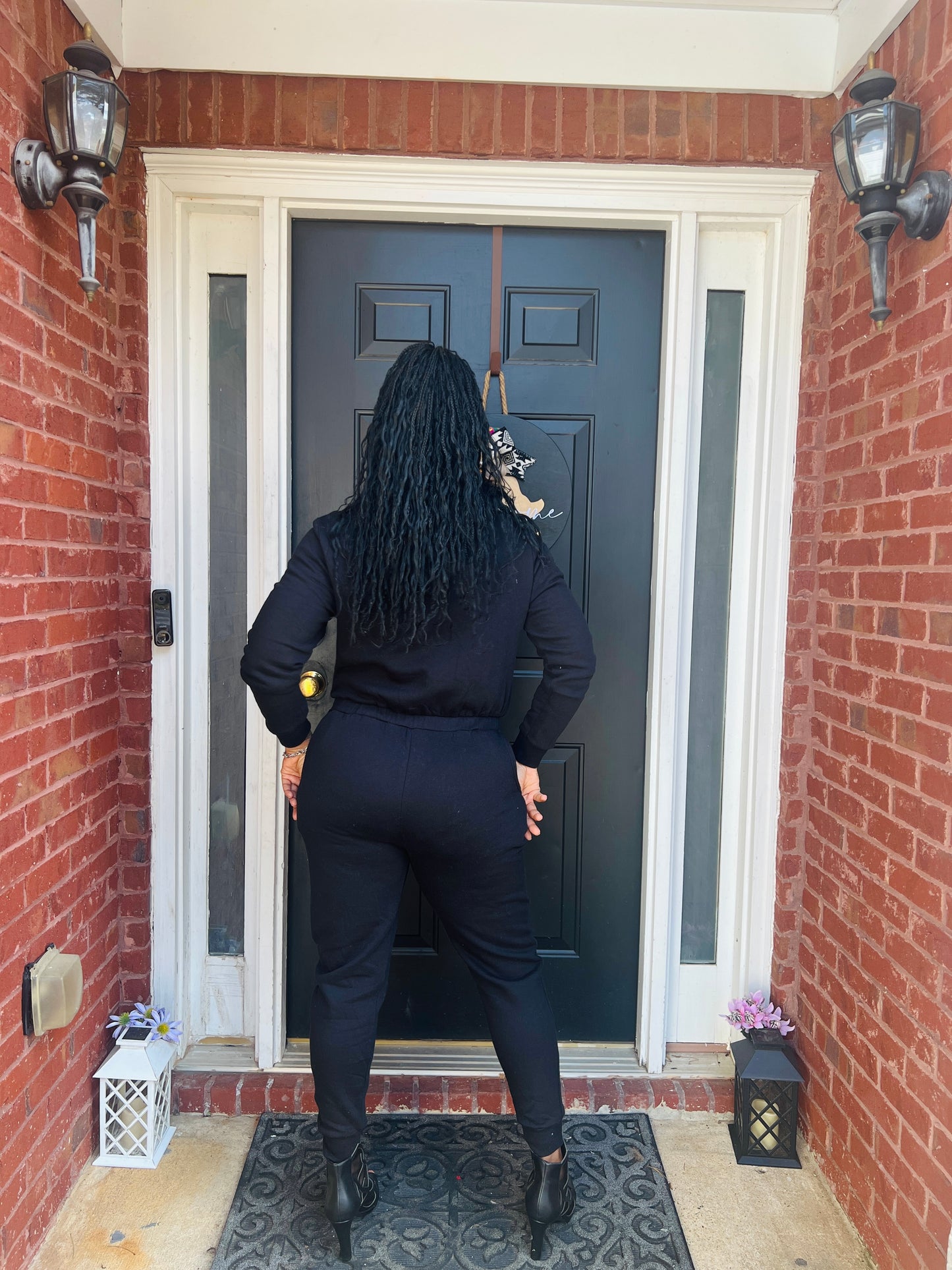 fleece jumpsuit in black with hoodie
