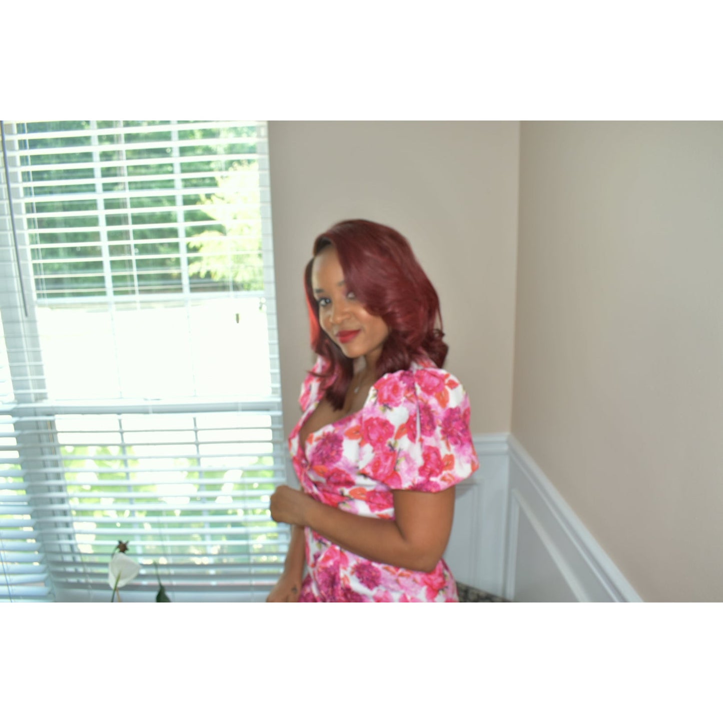 V-neck, surplice, short puff sleeve, mini length, ruffle, zippered back, and all over floral prin