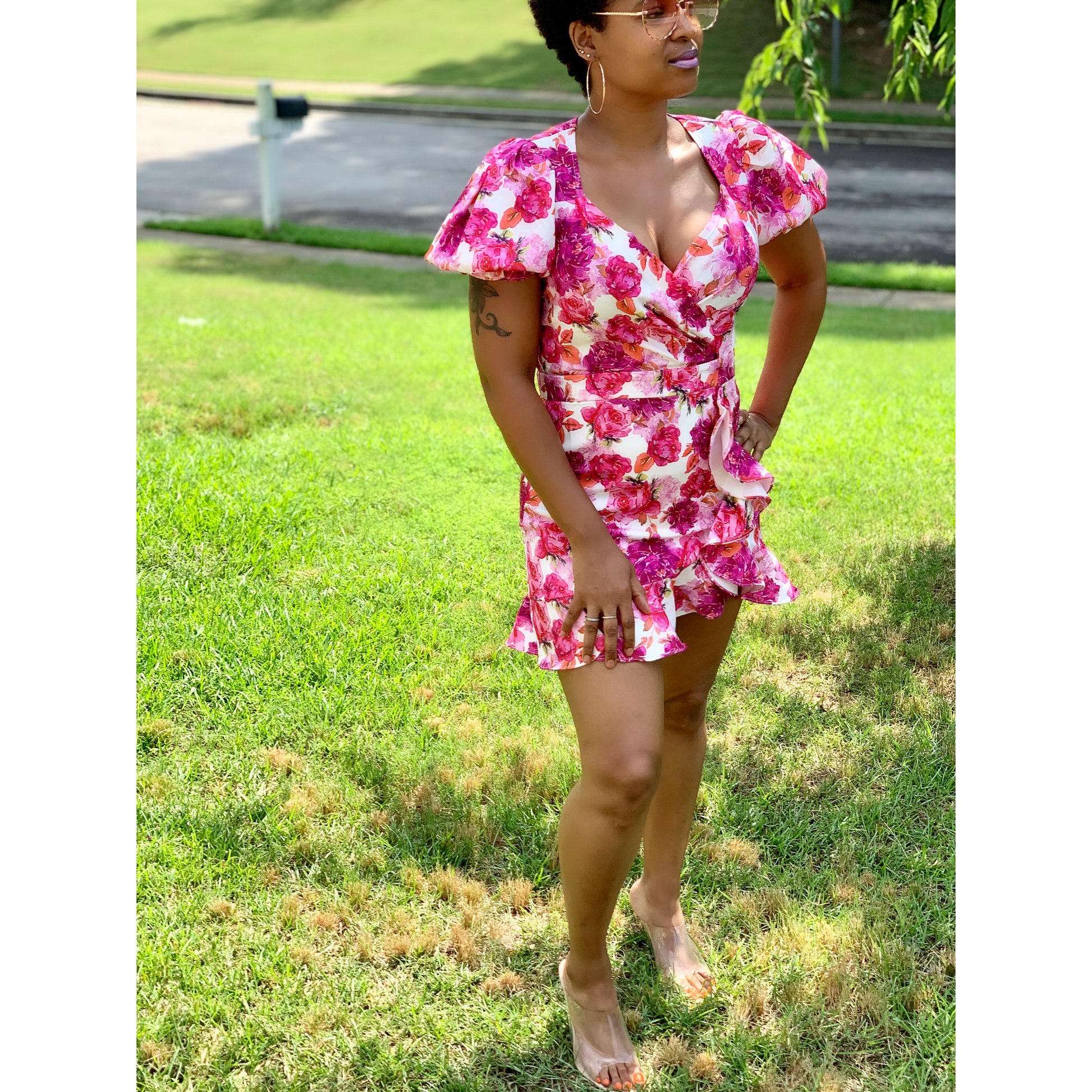 V-neck, surplice, short puff sleeve, mini length, ruffle, zippered back, and all over floral prin